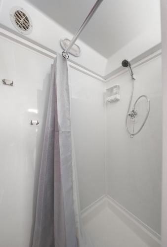 a shower in a bathroom with a shower curtain at Boho Bliss Yurt - Unit # 4 in Woodway