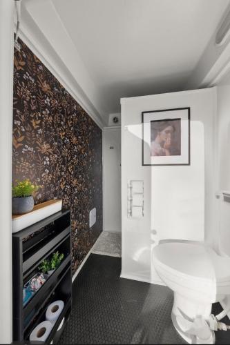 a bathroom with a white toilet in a room at Boho Bliss Yurt - Unit # 4 in Woodway