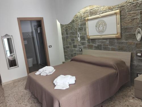 Postel nebo postele na pokoji v ubytování nuova oreto stazione rooms