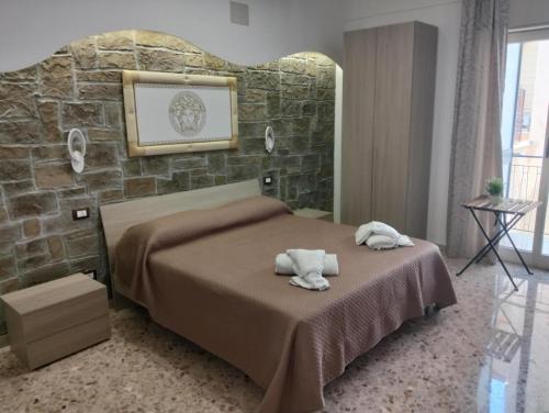 Postel nebo postele na pokoji v ubytování nuova oreto stazione rooms