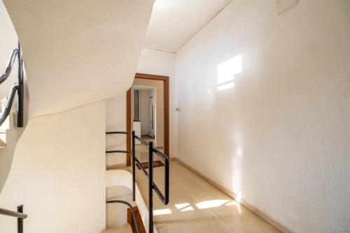 a staircase in a house with a stair case at Azure7 Seaside - Luxury Apartment in Varkiza in Vari