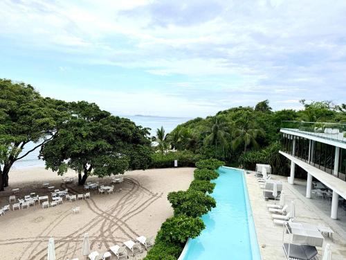 a resort with a swimming pool and a beach at Bolongo 2BR your exclusive oceanfront escape in Punta Mita