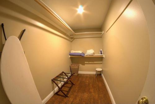 a hallway with a room with a ladder and a shelf at Family Friendly Close of Strip Hot Tub and Driveway in Las Vegas