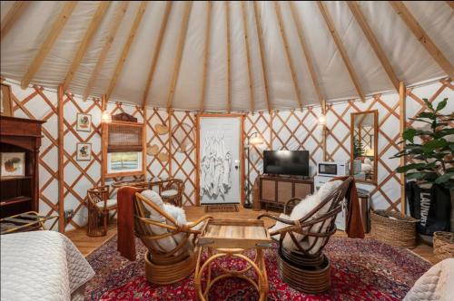 a room with a yurt with chairs and a table at Boho Bliss Yurt - Unit # 4 in Woodway