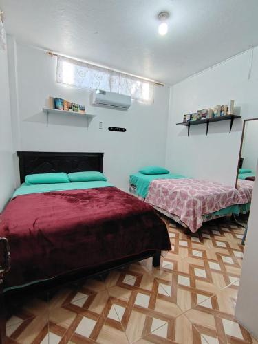 Llit o llits en una habitació de Cuarto en galápagos