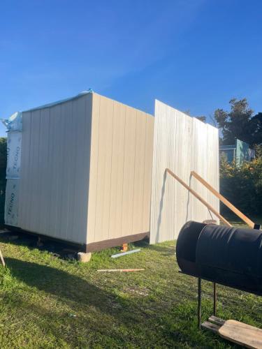 a large container sitting on top of a grass field at Casa Acantilados Suites in Mar del Plata