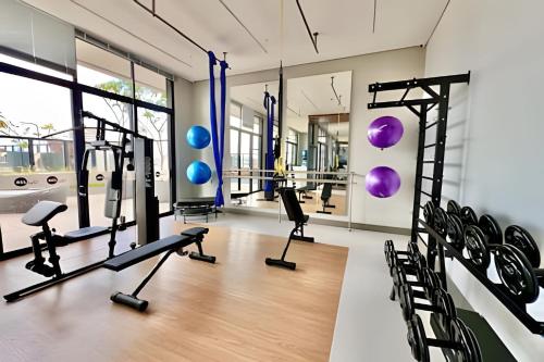 a gym with treadmills and elliptical machines at #SeUReFúGio na Melhor Região de CWB in Curitiba