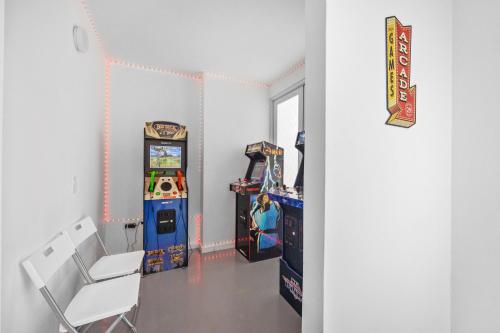a room with a video game machine and a chair at 65 Condado by Otium in San Juan