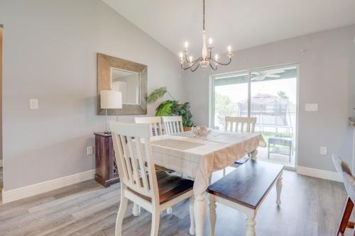a dining room with a table and chairs at COZY home with fenced patio in Ocala