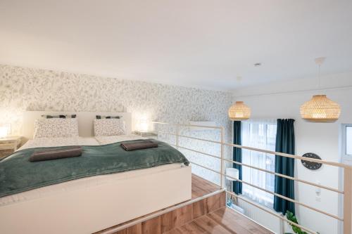 Кровать или кровати в номере West Nest