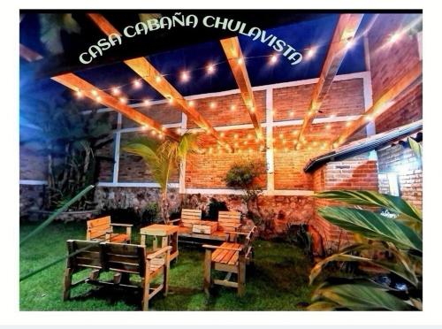 a restaurant with a table and chairs in front of it at Casa CABAÑA CHULA VISTA a 5 minutos del centro in Tequila