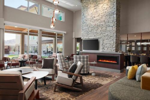 a living room with a fireplace and furniture at Residence Inn by Marriott Reno South in Reno