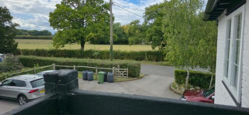 a view of a car parked in a parking lot at The George and Dragon Pub in Shipley