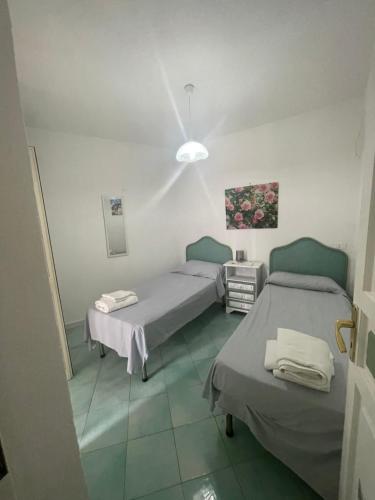 a hospital room with two beds in it at Dimora del Verde in Ischia
