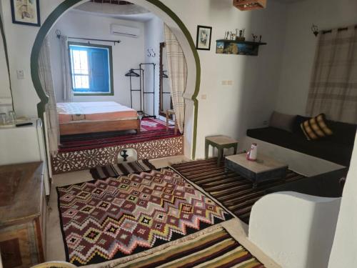 Résidence Ulysse Djerbaにあるベッド
