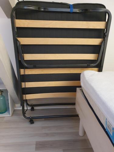 a bed frame in a room with a bed at 2 CHAMBRES chez nous Sorties A62 6 ou 6 1 in Saint-Laurent