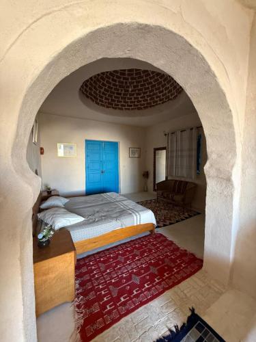 Résidence Ulysse Djerbaにあるベッド