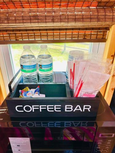 a coffee bar with two bottles of water at Jungle Haven Yurt- Unit #2 in Woodway