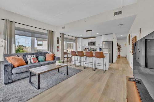 a living room with a couch and a table at Stay in Cleveland mins to Cleveland Clinic, Hospitals, Museum, Universities & Downtown in Cleveland