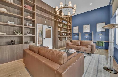 a living room with a couch and a table at Stay in Cleveland mins to Cleveland Clinic, Hospitals, Museum, Universities & Downtown in Cleveland