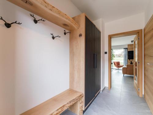 a hallway of a house with a staircase and a door at Bergzicht 2A in Sankt Lorenzen ob Murau