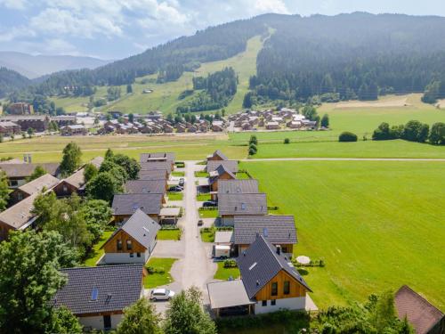 an aerial view of a village with houses and a field at Bergzicht 2A in Sankt Lorenzen ob Murau