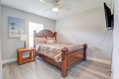 a bedroom with a bed and a ceiling fan at COZY home with fenced patio in Ocala