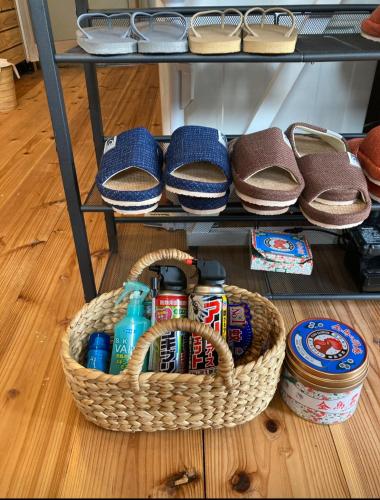 a basket sitting on the floor next to a table at Guest House Henza in Henza
