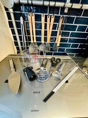 a bunch of kitchen utensils on a kitchen counter at Guest House Henza in Henza