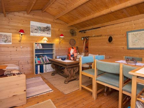 a room with a desk and chairs in a cabin at 6 person holiday home in Brædstrup-By Traum in Brædstrup