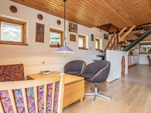 a room with two chairs and a desk in a house at 10 person holiday home in Fur in Fur