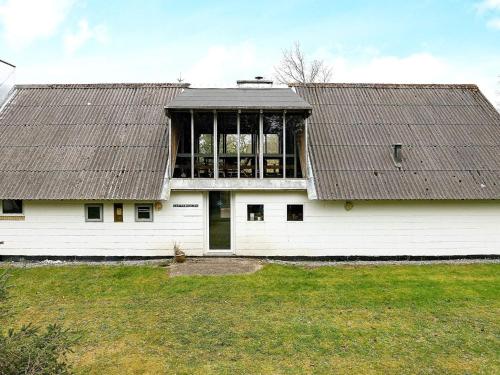 a large white building with a large window at 10 person holiday home in Fur in Fur