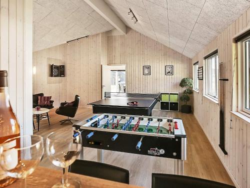a room with a ping pong table in the middle at Luxury Villa with Pool - By Traum Ferienwohnungen in Vejby
