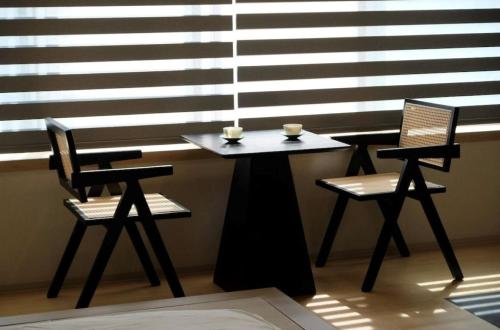 a table and two chairs with two cups on it at Jasmin Nishikimachi 5 - Vacation STAY 13093v in Takamatsu