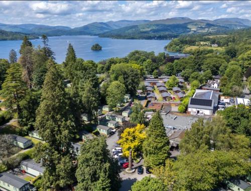 an aerial view of a small town next to a lake at 57 The Meadows FallBarrow Park in Bowness-on-Windermere