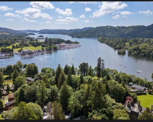an aerial view of a river with boats on it at 57 The Meadows FallBarrow Park in Bowness-on-Windermere