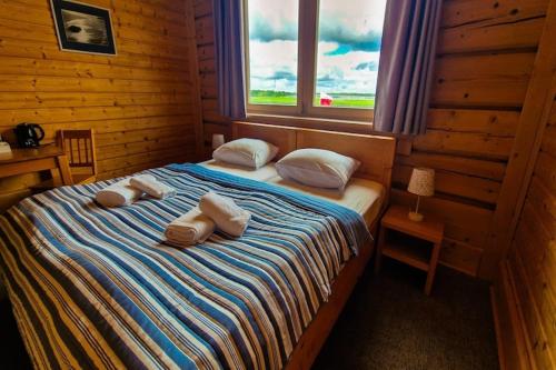 a bedroom with a bed with towels on it at Studio for 4 people in winouj cie in Świnoujście