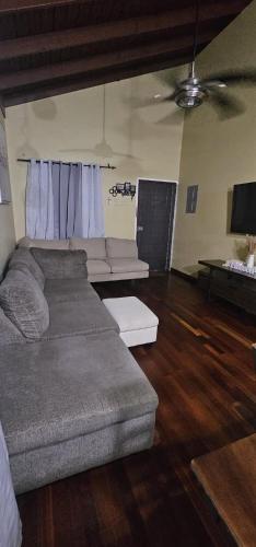 a living room with a couch and a table at Gentle Breeze in Kingston