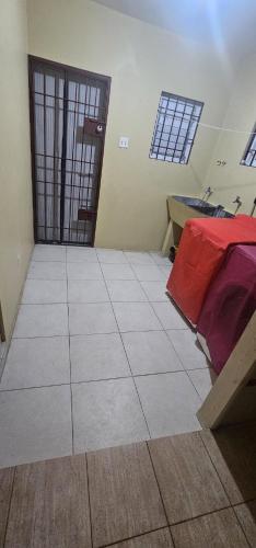 a room with a room with a door and a floor at Gentle Breeze in Kingston