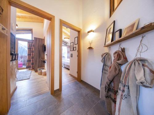 a hallway of a house with a door and a hallway at Cozy Mountain Chalet with sauna in Neukirchen am Großvenediger