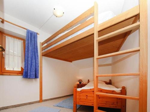 a bedroom with two bunk beds and a window at Chalet in Königsleiten near Zillertal Arena in Königsleiten
