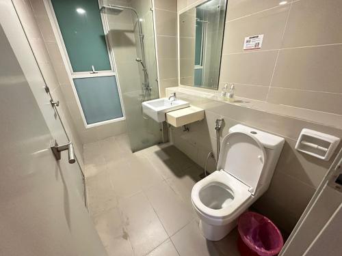 a bathroom with a toilet and a sink at SA Sutera Avenue Homestay - Kota Kinabalu Area KK City Opposite Imago in Kota Kinabalu