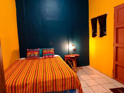 Postel nebo postele na pokoji v ubytování Expresión cultural restaurante y alojamiento