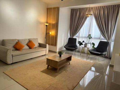 a living room with a couch and a coffee table at Bali Residence Melaka near Jonker Street in Melaka