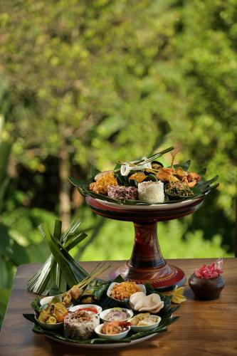 a plate of food on top of a table at Devani Resort Sidemen in Sidemen