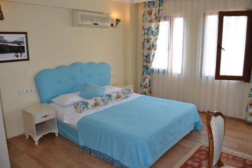 Ένα ή περισσότερα κρεβάτια σε δωμάτιο στο Setenay otel