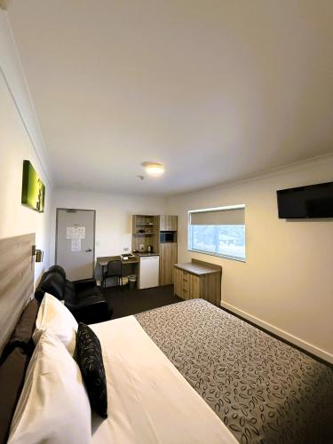 Μια τηλεόραση ή/και κέντρο ψυχαγωγίας στο Childers Oasis Motel