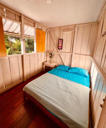 a bedroom with a large bed in a room at Casa Macondo Nuquí in Nuquí