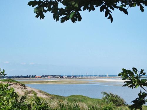 a view of a body of water with a beach at 6 person holiday home in Hadsund in Øster Hurup