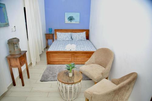 Un pat sau paturi într-o cameră la Coastal Charms Zanzibar